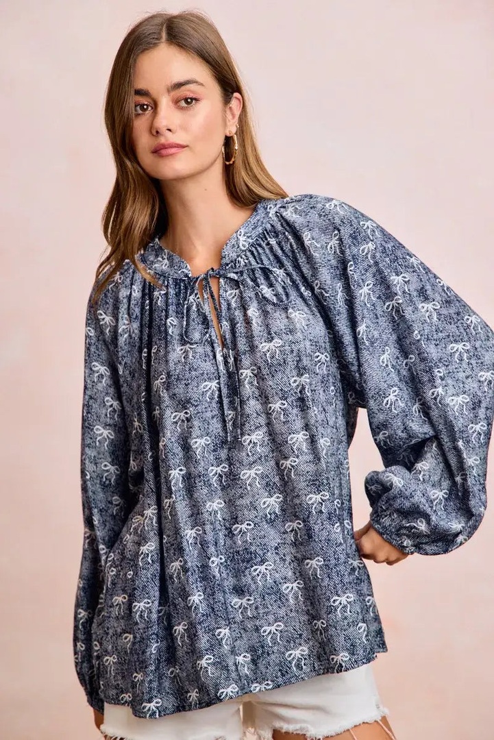 amomentofnow's tweet image. New arrival! ✨ Navy Blue Ribbon Bow Print Top with balloon sleeves is a playful statement piece. Pair with simple bottoms. Comfortable rayon-nylon blend. Try it: amomentofnow.com/products/bibi-… #Fashion #NewArrival #StatementTop