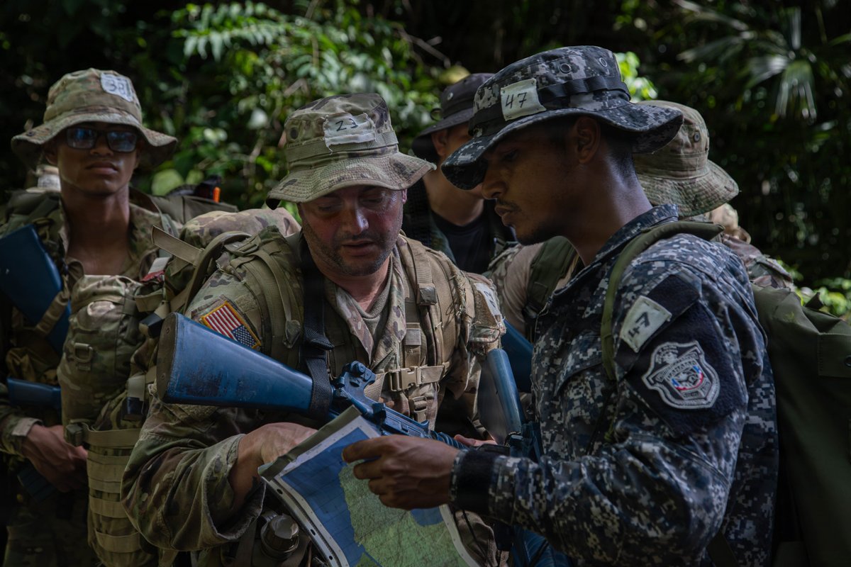 MARFORSOUTH's tweet photo. U.S. service members and Panamanian security forces conduct land navigation and ruck march training during Jungle Operations Training Course–Panama in Panama, Feb. 11, 2026. #USMC #PartnerForces #Readiness https://t.co/njkAEudQcm