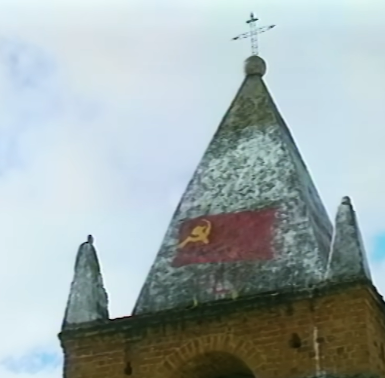 Flag of the Shining Path painted atop a church