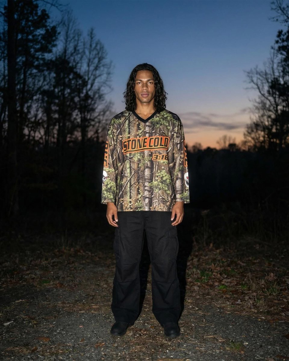 MigsMedia1's tweet photo. The @steveaustinBSR Camo Hockey Jersey is Now Available exclusively at https://t.co/F70GH7ymk4

Official Licensed by: @WWE 
#Chalkline #StoneCold #Austin316 #MigsMedia1 @chalklineco #Designer #WWE #WrestleMania #WWE2K26 #AttitudeEra https://t.co/dYiEbTWLC2