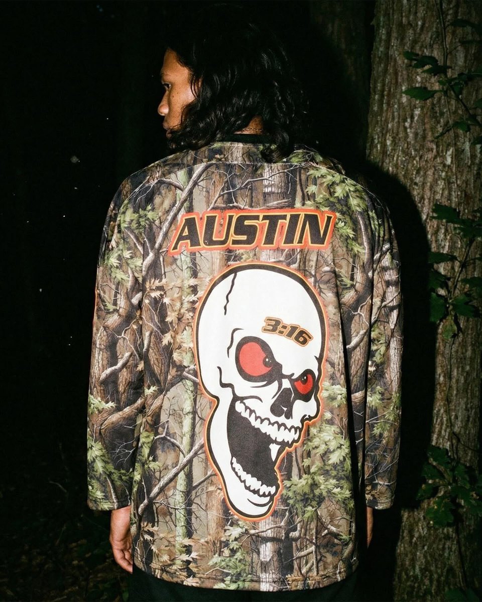 MigsMedia1's tweet photo. The @steveaustinBSR Camo Hockey Jersey is Now Available exclusively at https://t.co/F70GH7ymk4

Official Licensed by: @WWE 
#Chalkline #StoneCold #Austin316 #MigsMedia1 @chalklineco #Designer #WWE #WrestleMania #WWE2K26 #AttitudeEra https://t.co/dYiEbTWLC2