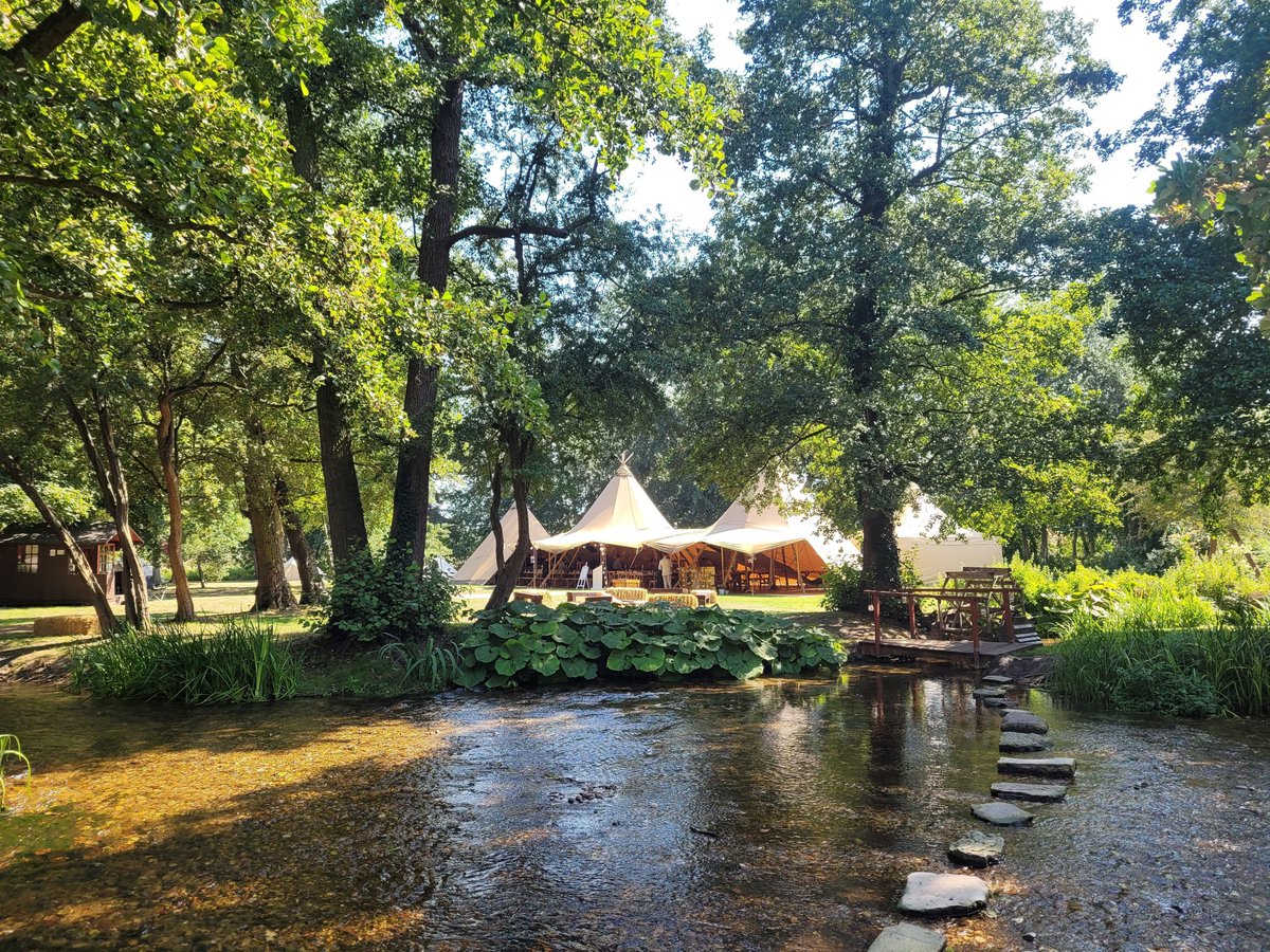 Our venue boasts riverside setting where the landscape does the work. The tipi sits among the trees, with the water and stepping stones becoming part of the walk through the day. Simple, natural, and made for couples who want their surroundings to be a big part of their day.