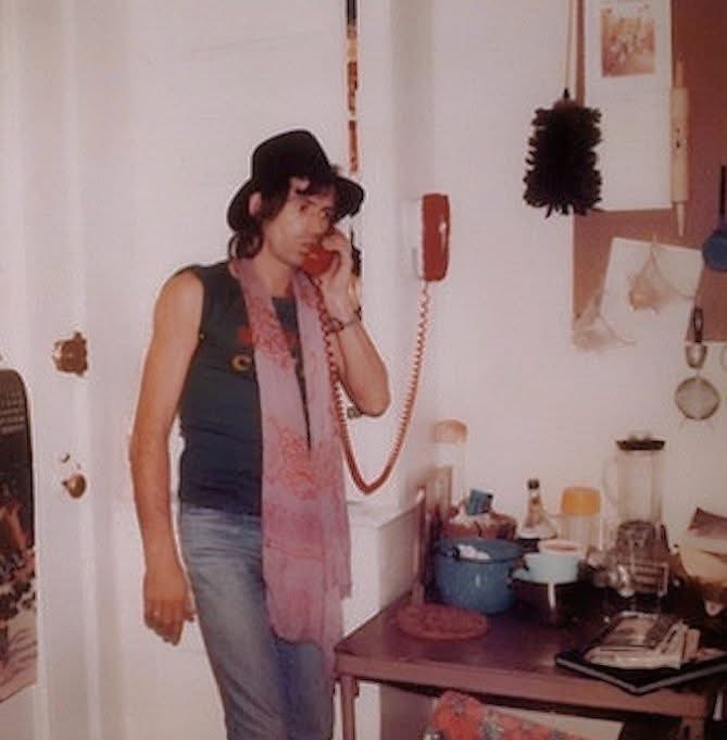 fred79977's tweet image. Keith in this photo was taken in Jamaica circa 1977. In the picture, Richards is seen using a phone stuck to a wall in an area that appears to be a kitchen. She wore a black hat, a dark sleeveless shirt, jeans, and a pink scarf around her neck.
#Keith 
#RollingStones