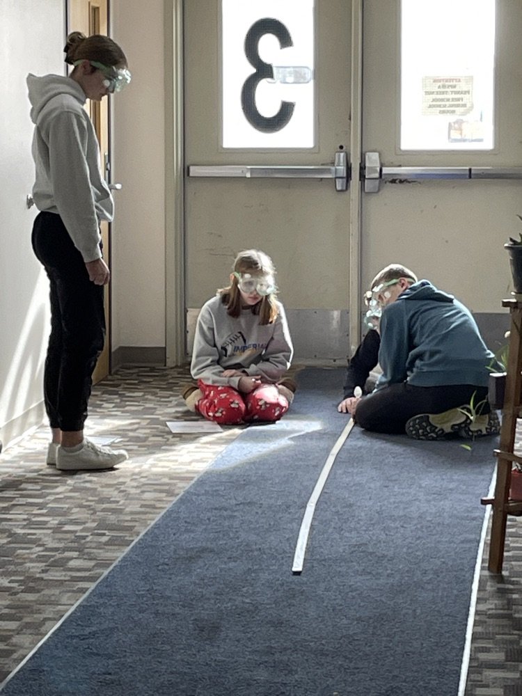 Physical science class testing projectile motion: trying to determine if angle of release has effect on flight path.