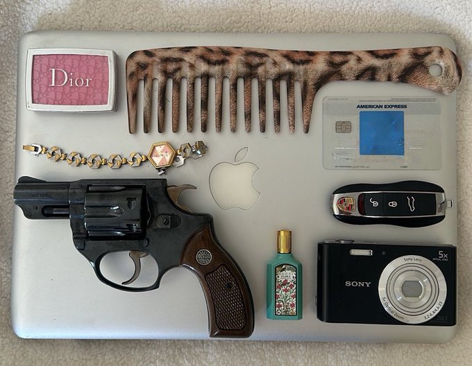Bella456555's tweet photo. A mix of luxury and everyday essentials 👜💄🔑📱✨ Embracing style, technology, and a little bit of edge! 💫🔫📸 https://t.co/fKNCokKqi2
