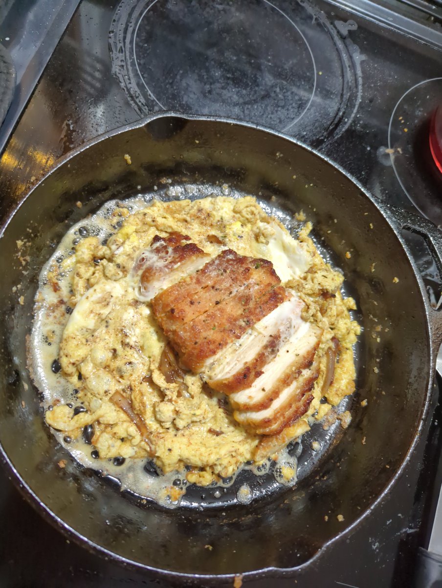 TimTheScarecrow's tweet photo. Assemble. In a cup, mix 2 eggs along with a ladle full of the sauce and red pepper flakes. In your skillet drop a handful of the onions. Then place your now sliced pork cutlet over top. Then slowly add your egg sauce mix over that. Cover and steam til egg looks done. https://t.co/evL2jO7CXD