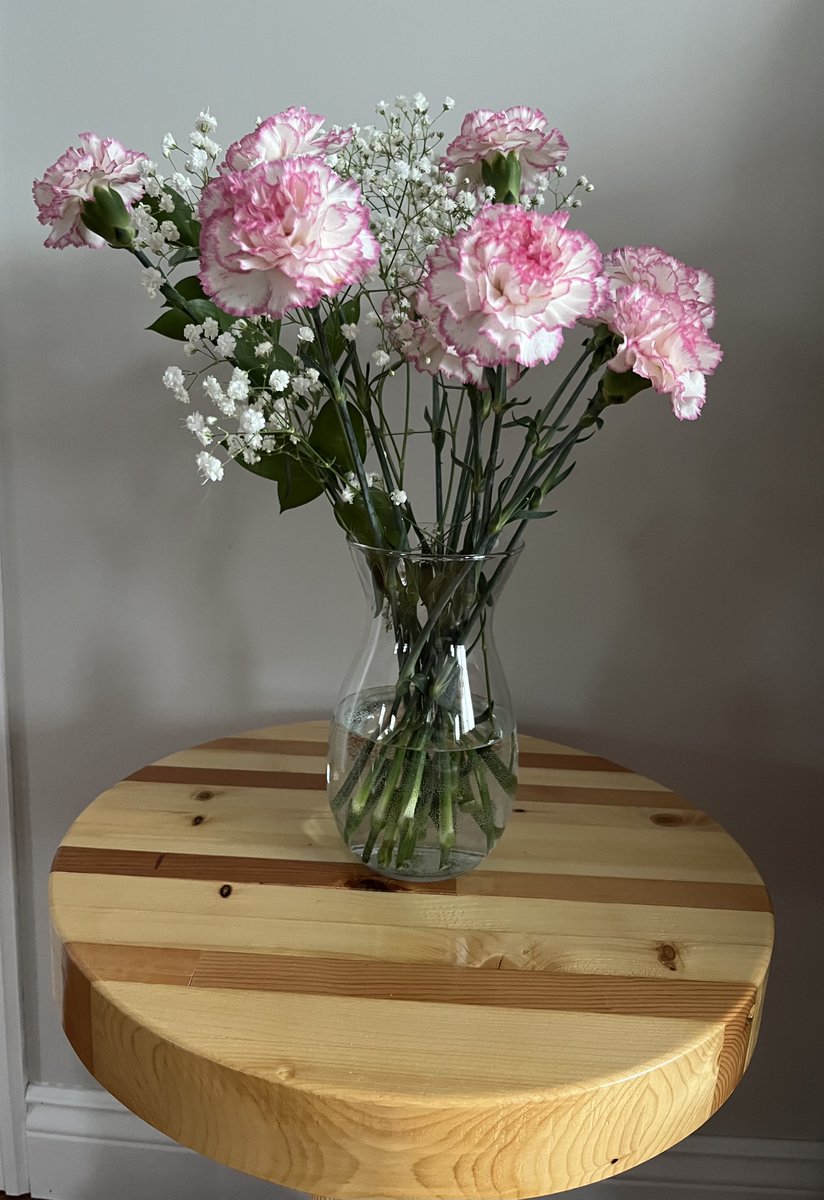 Something beautiful about a simple arrangement of flowers on a homemade side table #simplicity