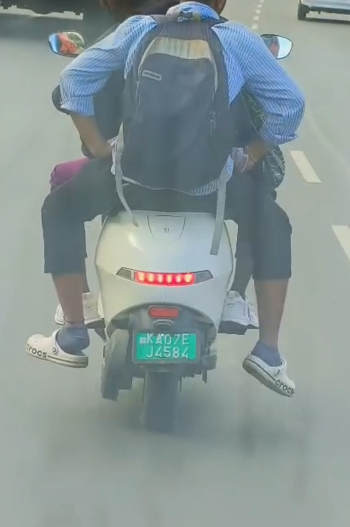 nonstern688's tweet photo. @blrcitytraffic Triple riding without helmet location hosur road towards silk board https://t.co/MM3c8NMczE