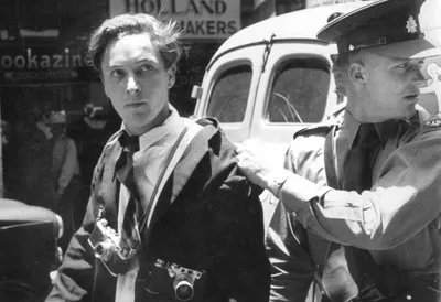 Photojournalist Jurgen Schadeberg is arrested at the treason trial of anti-apartheid activists in 1958. (Image Source: Drum Social Histories/BAHA)