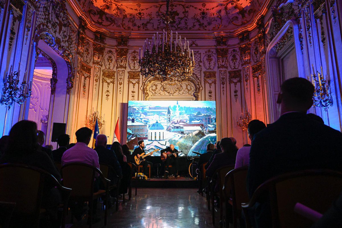 KosovoinHungary's tweet photo. The 🇽🇰Embassy in🇭🇺 hosted a state reception for diplomatic corps, 🇭🇺 inst. & diaspora on the 18th anniv. of 🇽🇰Independence.
The evening featured a concert by 🇽🇰 guitarist 🎸Agron Peni & a video exhibition by 📸Arben Llapashtica, showcasing Kosovo’s landscapes & culture.
#Kosova18 https://t.co/vCz0JMbKiC