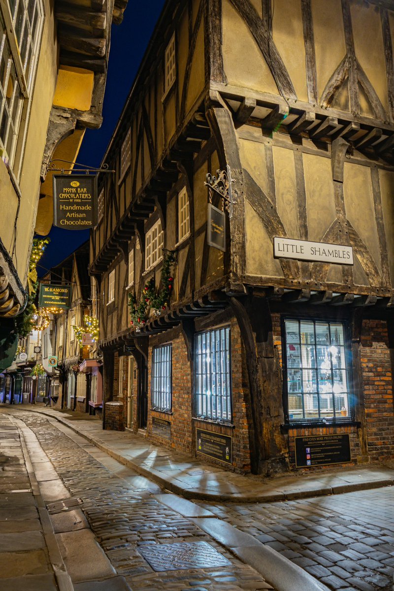 The Shambles in York, England-one of Europe's best-preserved medieval streets-has stood since at least the 11th century, with its distinctive timber-framed buildings largely dating to the 14th and 15th centuries, long before Columbus reached the Americas in 1492.