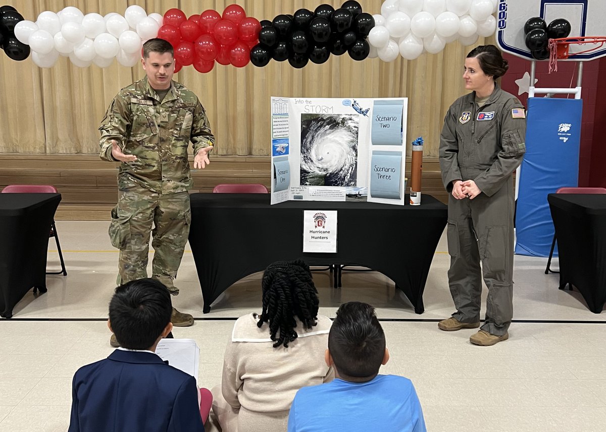 53rdWRS's tweet photo. Hurricane Hunters and a maintenance Airman visited a local school career day, giving students a close-up look at the WC-130J mission. From flight equipment to tools of the trade, they shared how teamwork keeps aircraft ready to fly into the storm. Inspiring the next generation of scientists, mechanics, and aviators—because big dreams can start in one classroom visit for many students.