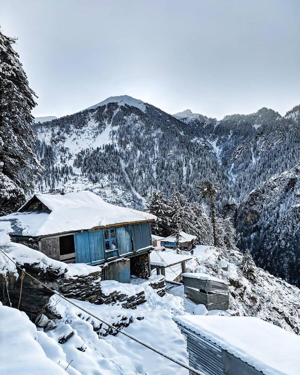 This was from my trip to one of the oldest villages in Himachal Pradesh, India.

far away from civilization, surrounded by silence and dense winter snow. 

A tough 5 mile climb through the mountains led to this peaceful view, and every step was worth it. 

Some journeys test you