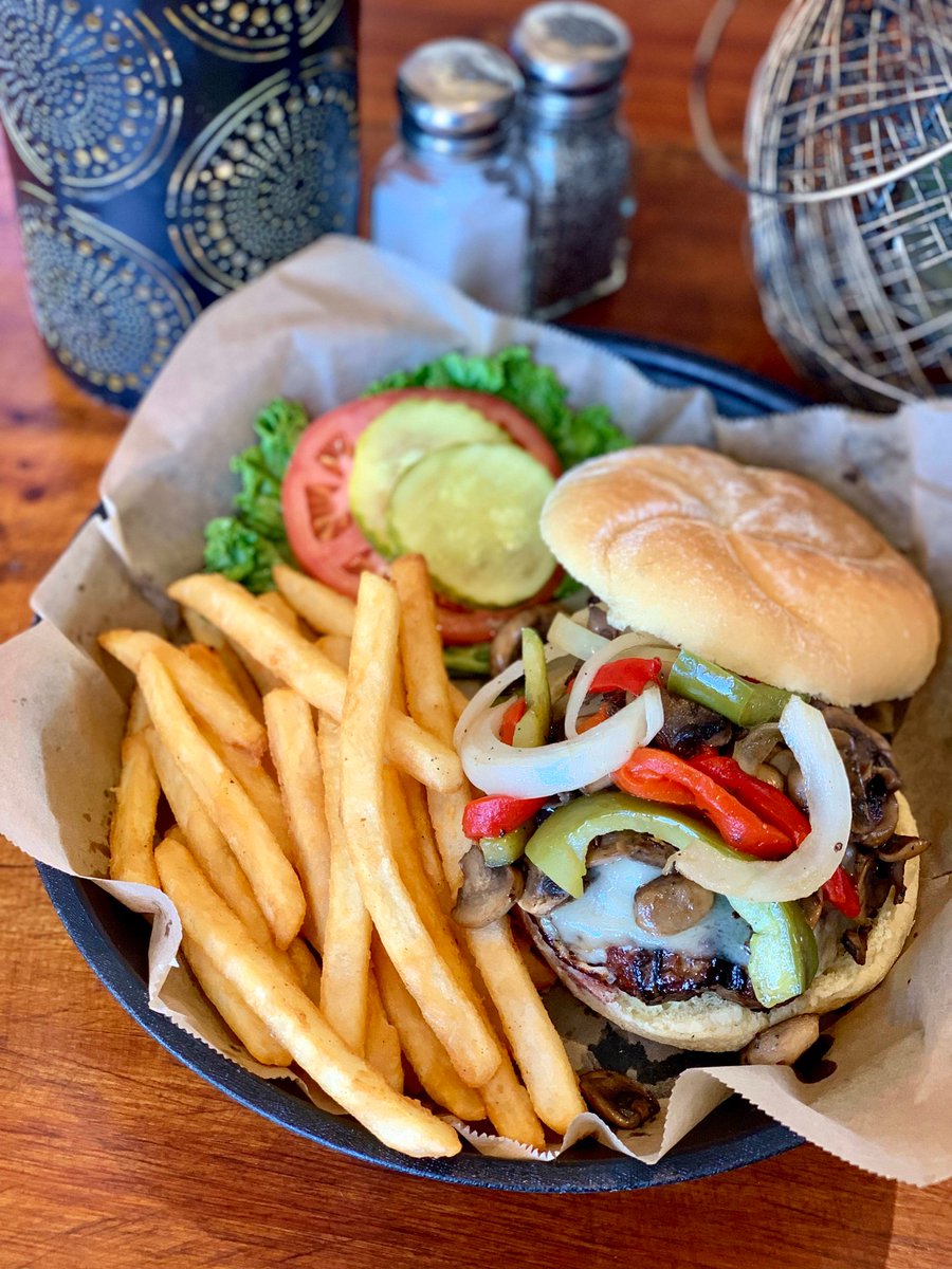 Nothing beats the classic comfort of our Smothered Burger! 🍔 Dressed with American cheese, peppers, mushrooms, and onions - it's a feast for your taste buds. #BobbyByrnes #BurgerLove #FoodieFriday 🎉