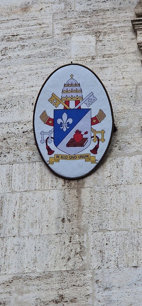 Confusion abounds as this photo, if real, shows Leo XIV's coat of arms with a tiara, whereas the illustrations released by the Vatican show the Novus Ordo miter instead. 