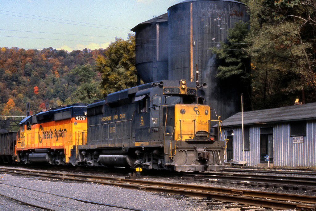 C&amp;O GP30 #3038 and Chessie System/C&amp;O GP40-2 #4376 have the Loup Creek Shifter heading east with loaded hoppers through Thurmond, West Virginia during October of 1980.  Rob Kitchen photo.

american-rails.com/chessie.html