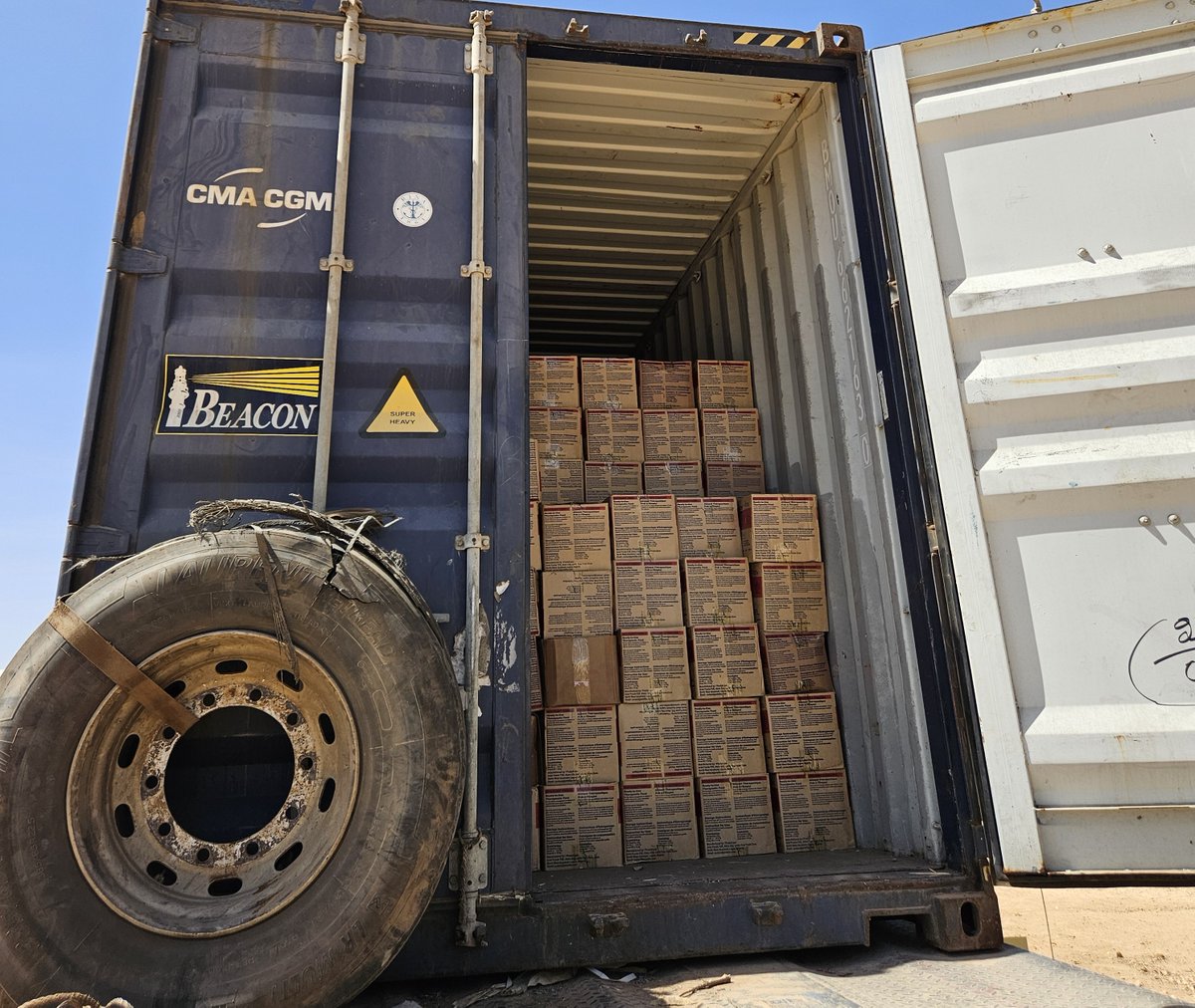 UNICEFChad's tweet photo. Funded by @SwissDevCoop , 4,000 cartons of life-saving ready-to-use therapeutic food from N’Djamena are being unloaded in our Abéché warehouse in eastern Chad, to treat children suffering from severe acute #malnutrition. https://t.co/WN99X1MIb3