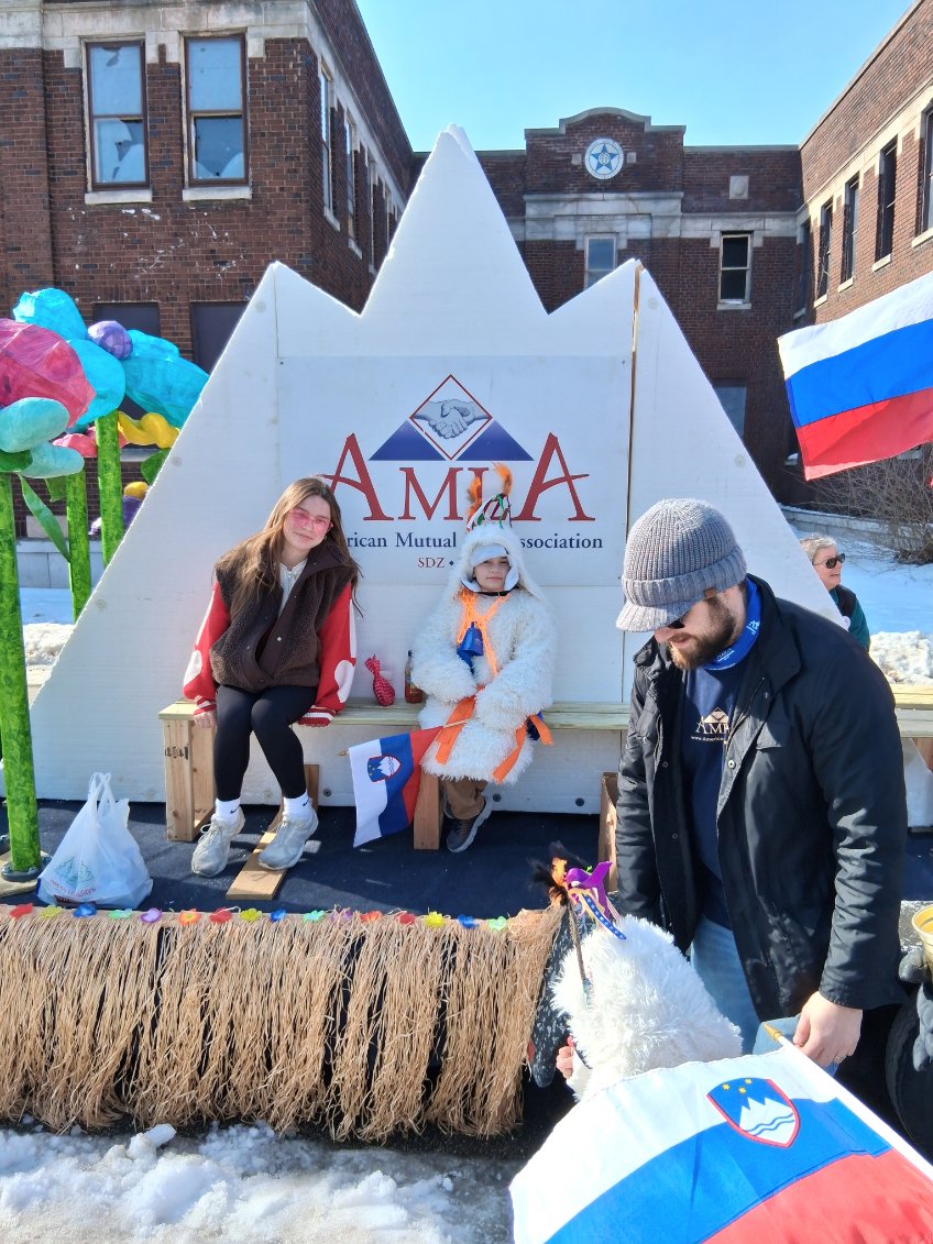 AMLA_SDZ's tweet photo. AMLA Members and friends enjoying the @ClevelandKurentovanje parade on the AMLA float!  AMLA Members handed out cow bells to the revelers to help them scare away winter!! #amla4life https://t.co/Y6DT3CPU4j