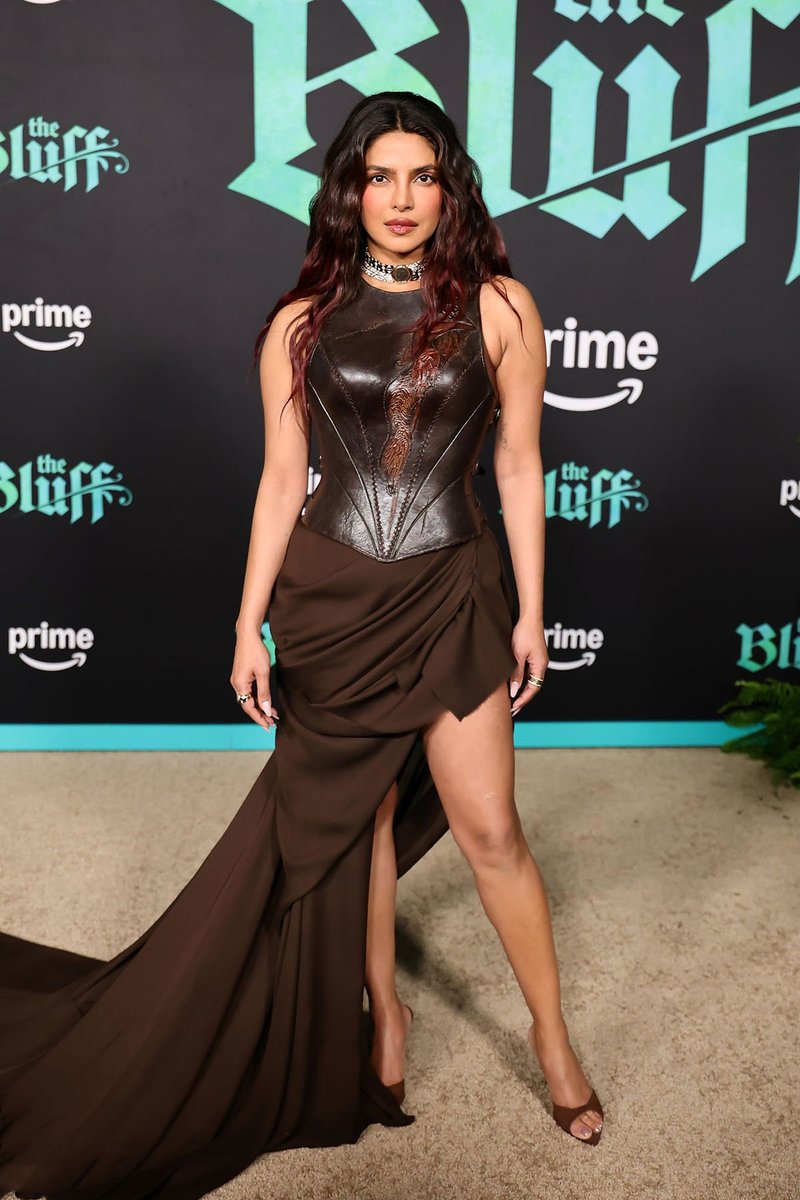 FashionHerald's tweet photo. Priyanka Chopra Jonas red-carpet method dressing at the world premiere of The Bluff in Los Angeles. Stepping out in a custom Antoinette Messam look, she didn’t just wear a gown—she wore a piece of the story. https://t.co/QH2bIBcS73
