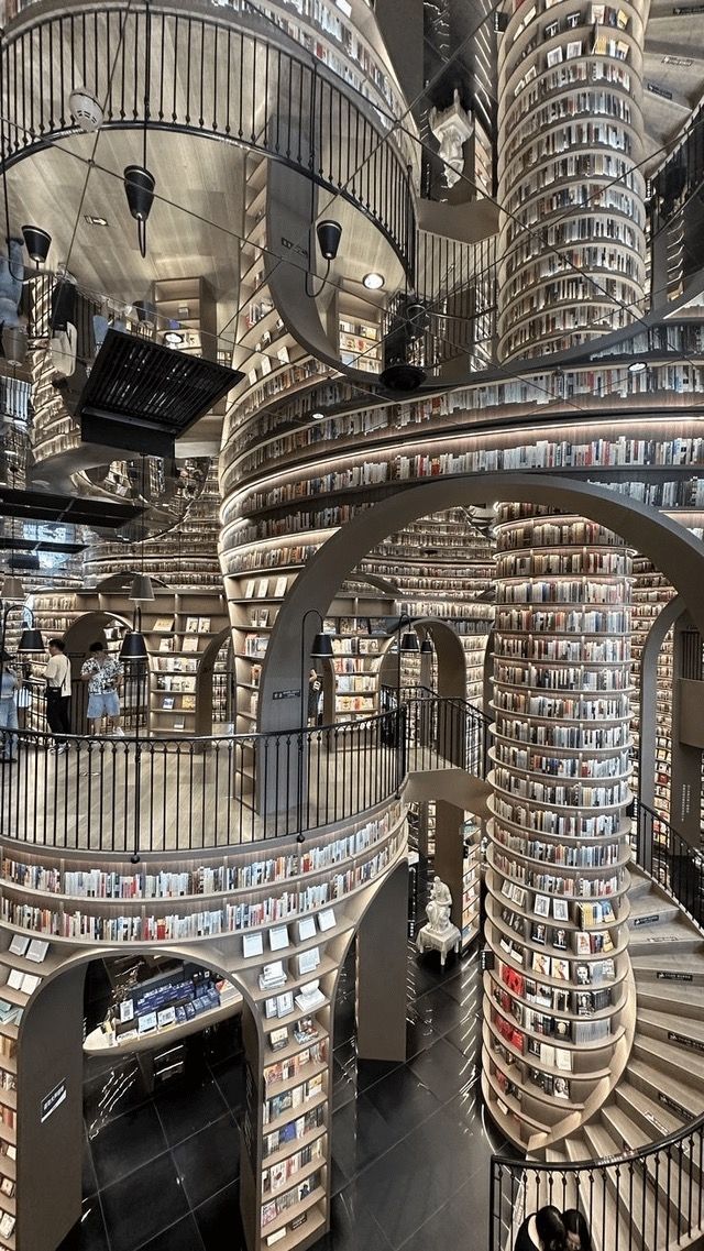 BookChat_'s tweet photo. ✨ Imagine browsing books in a surreal wonderland! Zhongshuge Library in China is turning heads with its mesmerizing, gravity-defying design. Would you visit? 📸📚 #BucketList #LibraryGoals https://t.co/LSNHbwHVo3