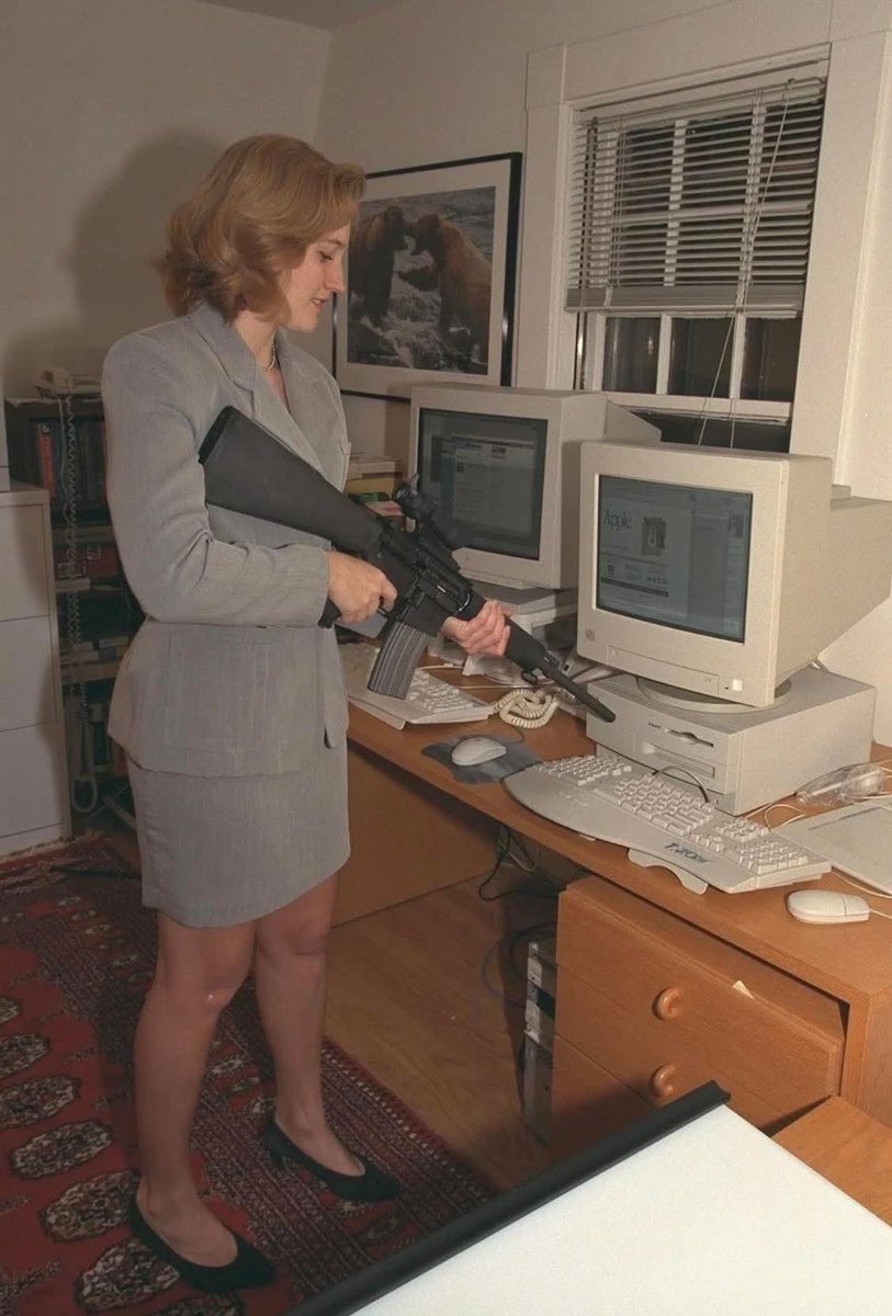Woman pointing a gun at a computer for some reason, 1998..... Taken at ...