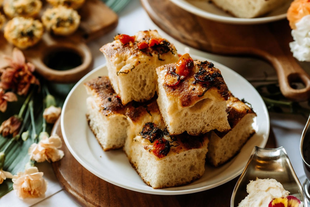 GreenMillCaters's tweet photo. 𝑭𝒐𝒄𝒂𝒄𝒄𝒊𝒂 𝑶𝒏 𝑭𝒍𝒆𝒆𝒌 ✨

2026 is all about flavor forward, shareable bites, and our focaccia boards are totally leading the trend. Golden, airy, and loaded with toppings, they’re perfect for any gathering that deserves a wow factor. https://t.co/9eh9Q5hytC