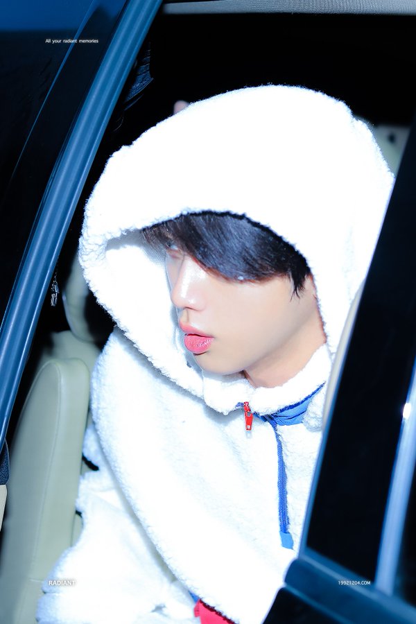 Jin just loves his white fluffy jacket
