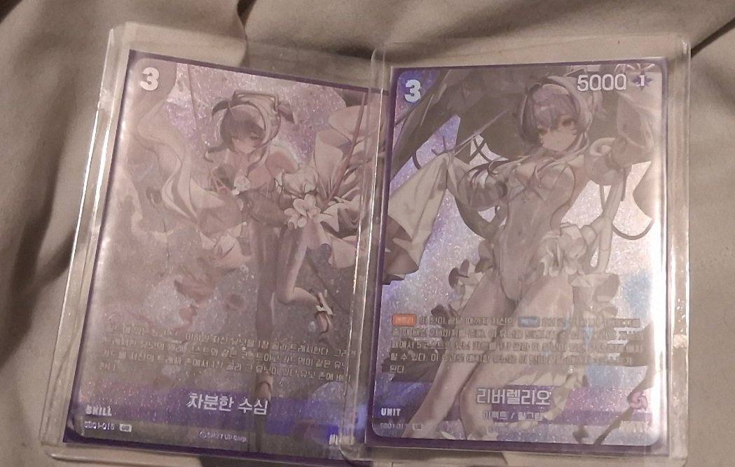 my friend sent me cards of my fave nikke girl from their tcg!! so pretty! :D