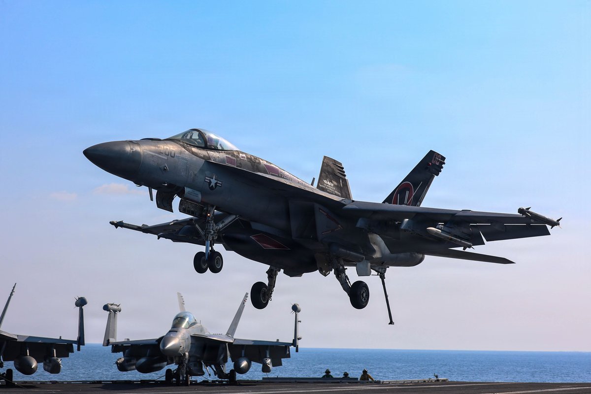 CENTCOM's tweet photo. F/A-18 Super Hornets from Strike Fighter Squadron 14 land on the deck of USS Abraham Lincoln (CVN 72) in the Arabian Sea. When launched from a catapult an aircraft carrier, the Super Hornet can go from a full stop to airborne in under 3 seconds. https://t.co/0mRLNMiwuJ