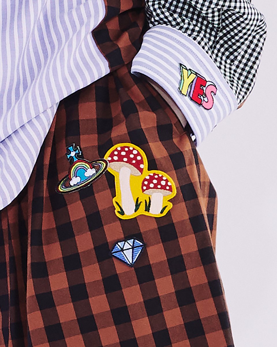 ポップなモチーフワッペンを散りばめた、ストライプとチェックを大胆に