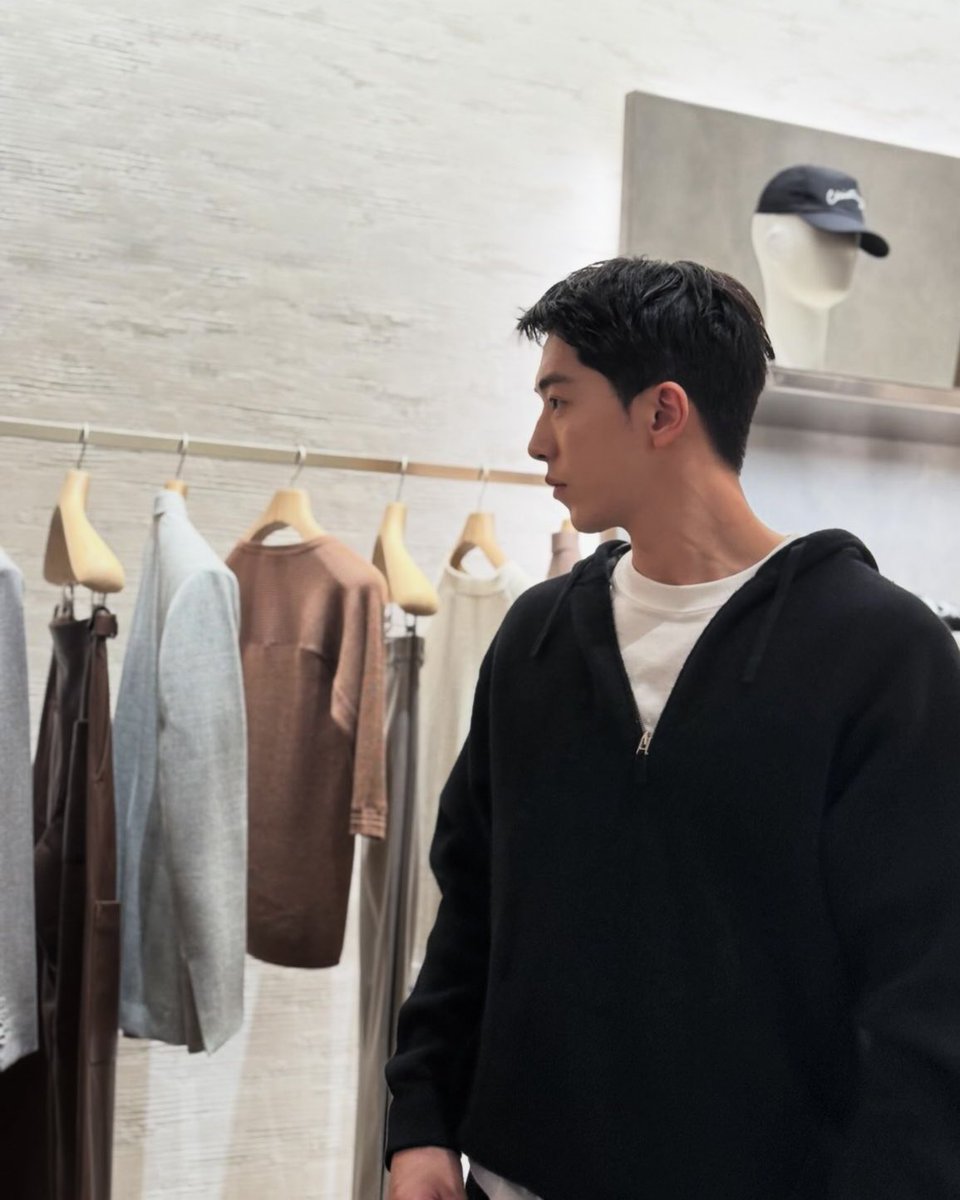 Hoodie on, out today. Stopped by some racks and started looking through the grays and beiges. Held a couple pieces up, felt the fabric for a bit. Just wandering like this feels good. Nothing big, just normal.