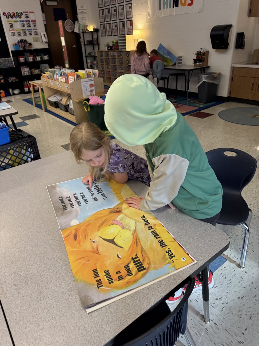 We went on a vowel hunt, searching through giant books to spot vowels in words! #SCEsoars