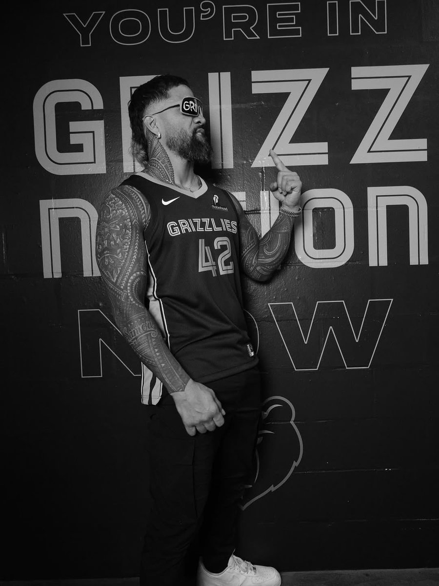 more of Jey with the Grizzlies jersey shirt on.🖤