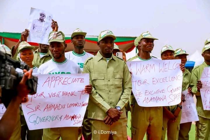 nysc360's tweet photo. It was a sea of khaki and a roar of excitement in Demsa LGA! #Adamawa #GovernorFintiri #ServiceAndLeadership #DemsaLGA #YouthInAction
Corps members serving in the area came out in their numbers to give Governor Ahmadu Umaru Fintiri a truly heroic welcome during his working tour. Dressed in their official NYSC uniforms, they lined the streets with placards and cheers, expressing their deep appreciation for his unwavering support for the scheme.
Beyond the fanfare, it was a moment of genuine connection. The Governor took time for an interactive session where corps members thanked him for creating an enabling environment for their service and Community Development projects. In a touching gesture, they presented him with a giftโa token of gratitude for his youth-friendly policies.
Governor Fintiri commended their discipline and patriotism, urging them to remain focused on contributing to their host communities. The event ended with smiles, photos, and a renewed commitment to collaboration between the government and the NYSC.