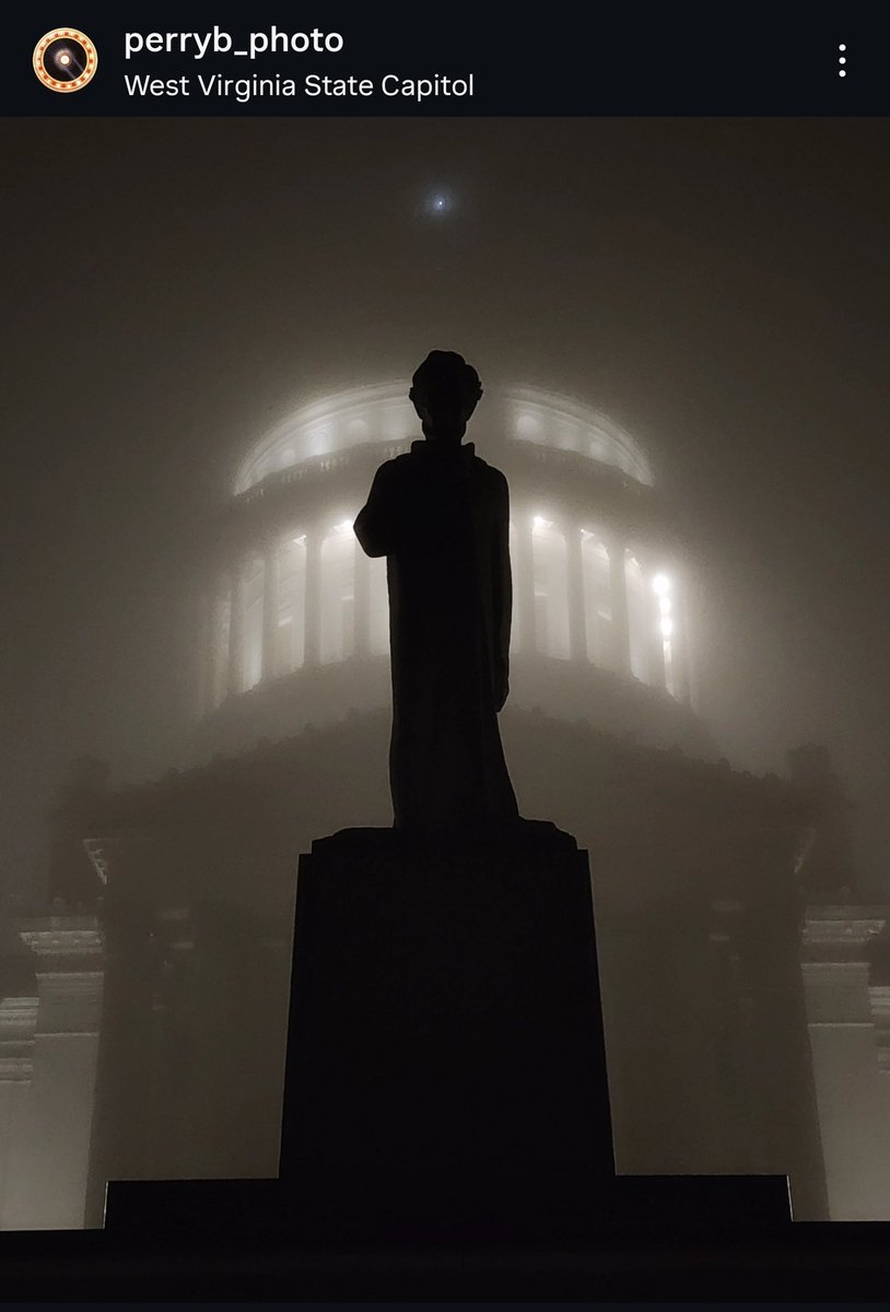 PerryB_Photo's tweet photo. A thick layer of fog obscures the monolithic  #WVCapitol, right behind the sculpture of "Lincoln Walks at Midnight" by Fred Martin Torrey. https://t.co/PHjAhlqYTz