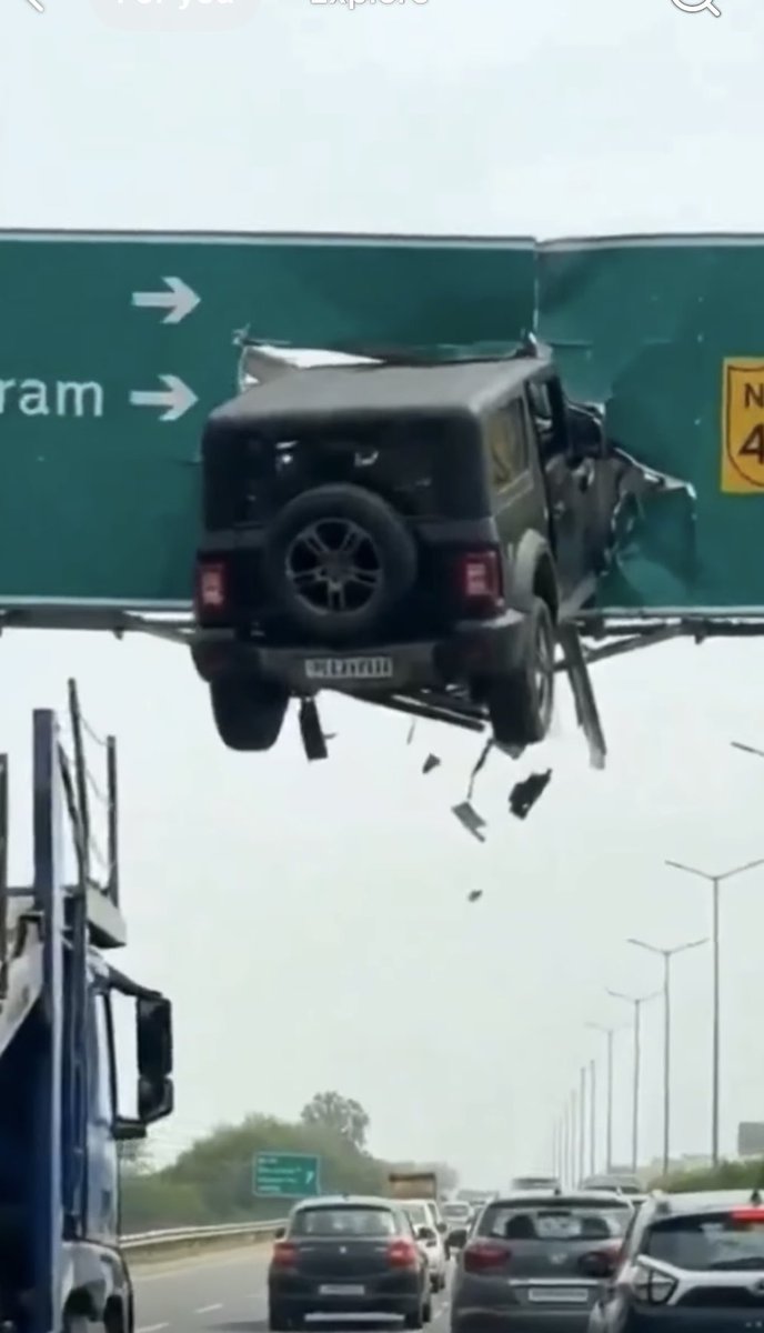 thenawakadal's tweet image. AI-generated video falsely shows a Thar SUV crashing into a highway sign