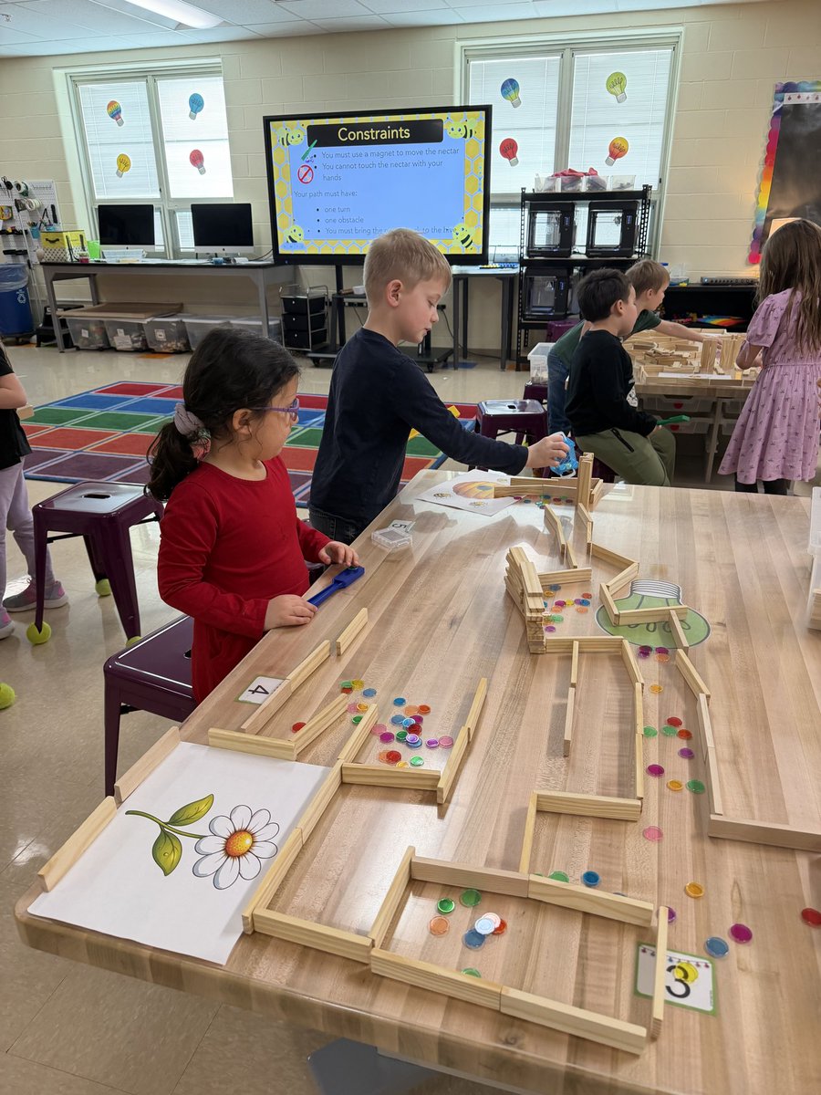 1st Grade STEM students have been learning about bees and magnets. Today, they built a hive-maze with <a href="/KEVAplanks/">KEVA® Planks</a> then used magnet wants to gather nectar from the flowers and bring it to the hive. 🐝 🧲