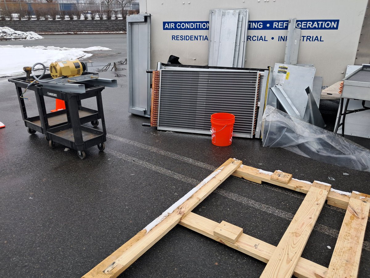 GuitarG71647302's tweet photo. Here's our new air handler unit being disassembled in the parking lot to be carried up to the boiler room piece by piece to be reassembled because there's no other way to get it in there.  😬
#NewAC #thursdaymorning https://t.co/U5bbkR0FfN