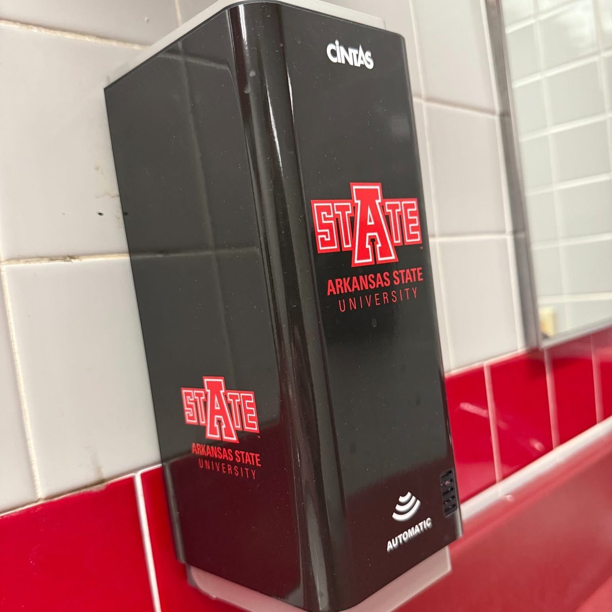 FNBArena's tweet photo. We’re continuing to invest in the fan and guest experience at First National Bank Arena.

Our restrooms now feature new automatic soap and paper towel dispensers, as well as new, larger toilet paper holders with custom A-State and First National Bank Arena branding - combining improved hygiene, modern functionality, and Red Wolves pride.

We’re committed to keeping our facilities first-class from top to bottom.