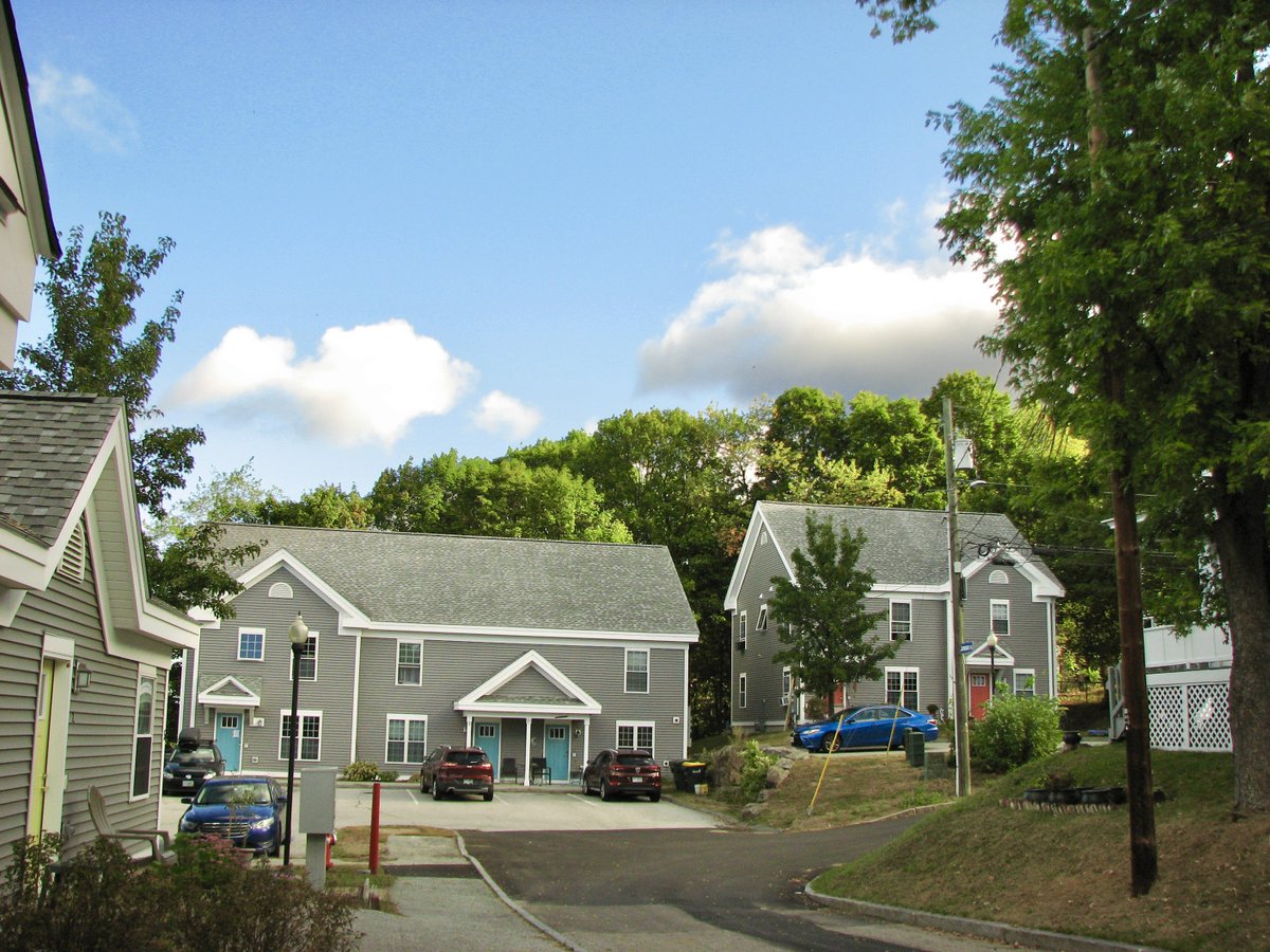 TripleConstruc2's tweet photo. Teamed up with our friends at Lakes Region Community Developers to give this 18-unit complex a total glow-up with roofing, siding, and new doors upgrades. Love how it turned out!  https://t.co/EvToKZl6jE https://t.co/65npP2HfIW