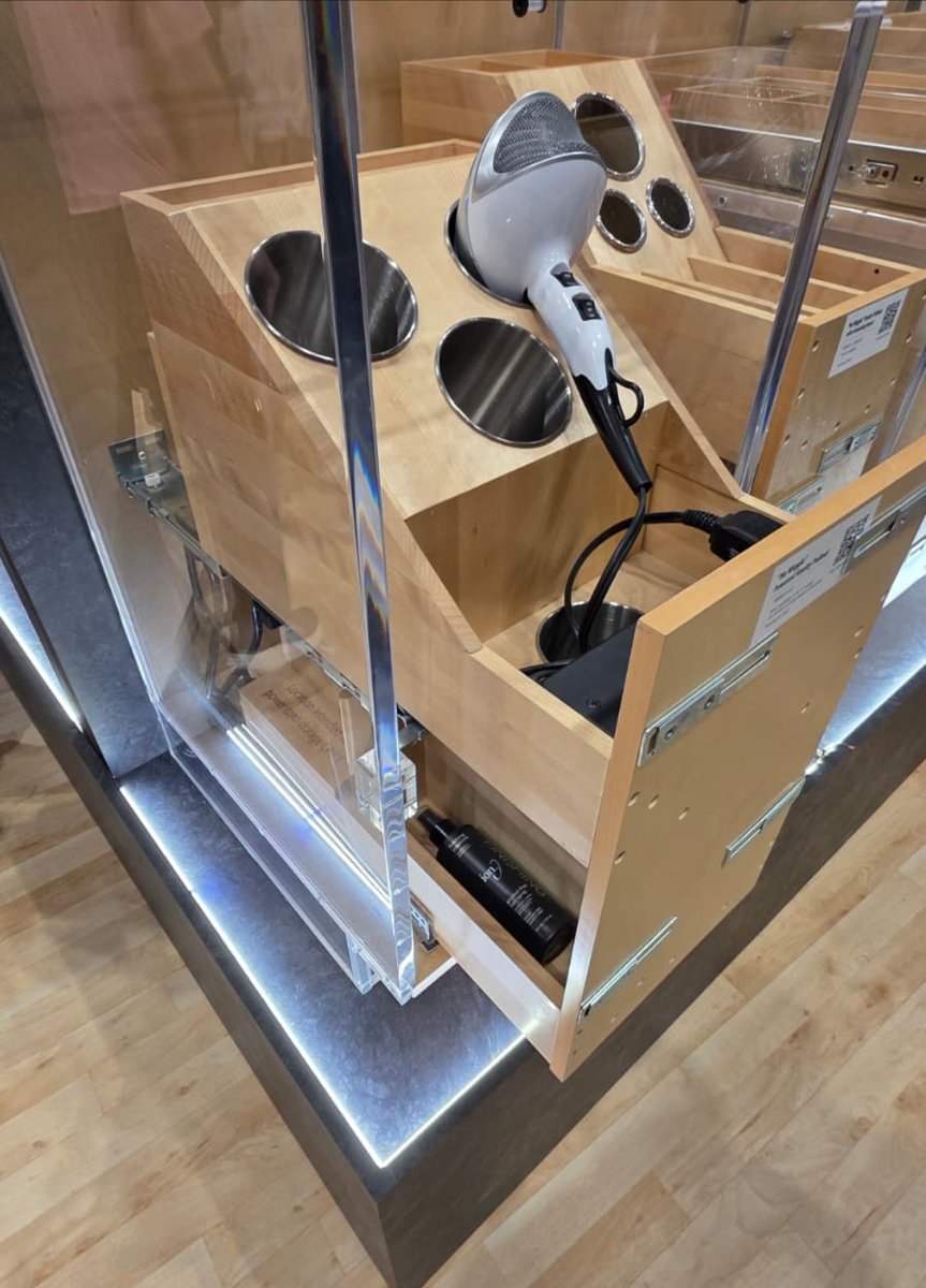 This powered vanity accessory, showcased at KBIS by Hardware Resources, keeps styling tools plugged in and shuts off power when closed. Genius! 🔌💄
#KBIS #BathroomRemodel #SmartStorage