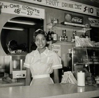 Debra Bell working inside her own diner 1958
