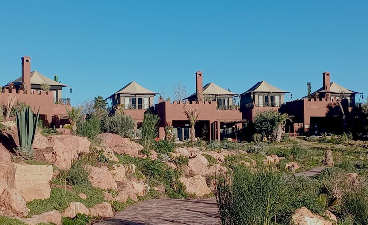 The photo captures a picturesque view of several luxurious Riad Rooftop Tented Suites at Kasbah Tamadot, the exclusive Virgin Limited Edition resort nestled in the foothills of the Atlas Mountains near Marrakech, Morocco (close to the Berber village of Asni). <a href="/ExclusiveTents/">Exclusive Tents International</a>