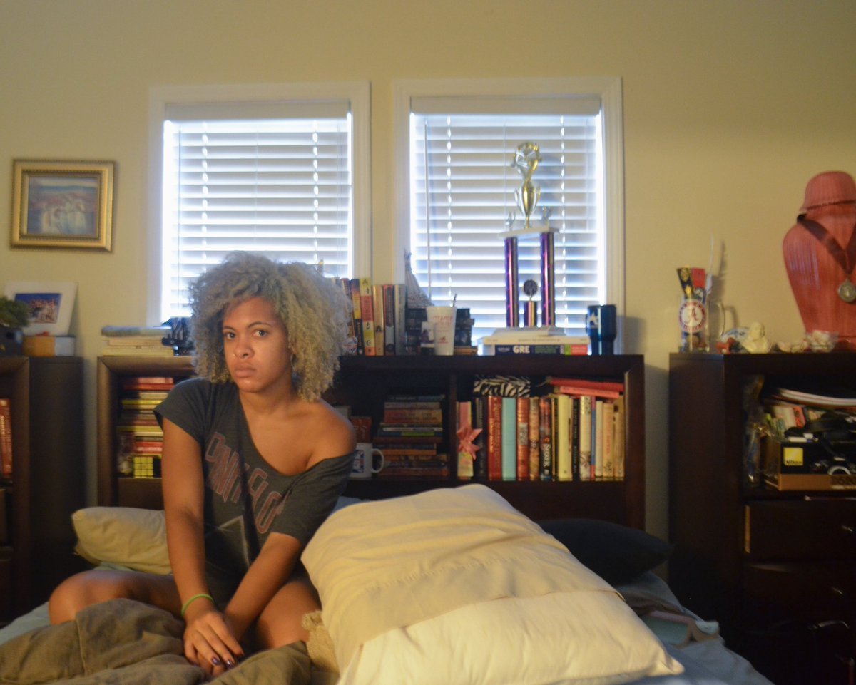 Me in my childhood bedroom in Atlanta. Reading has always been my happy place.