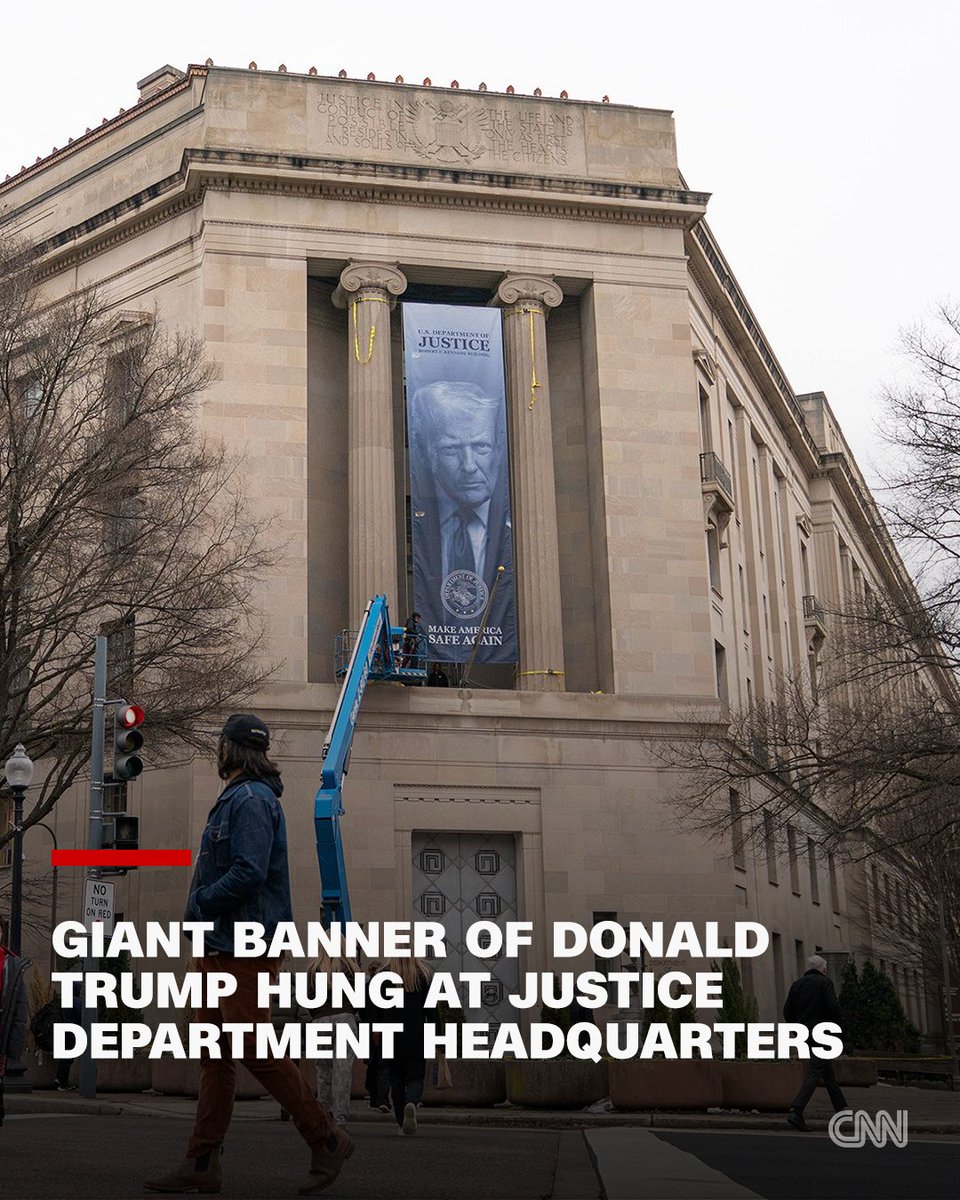 A large banner of Donald Trump was hung outside of the Justice Department headquarters in Washington, DC, emphasizing the White House’s control over the nation’s top law enforcement branch that once pursued criminal prosecutions against the president. cnn.it/46ZRXLP