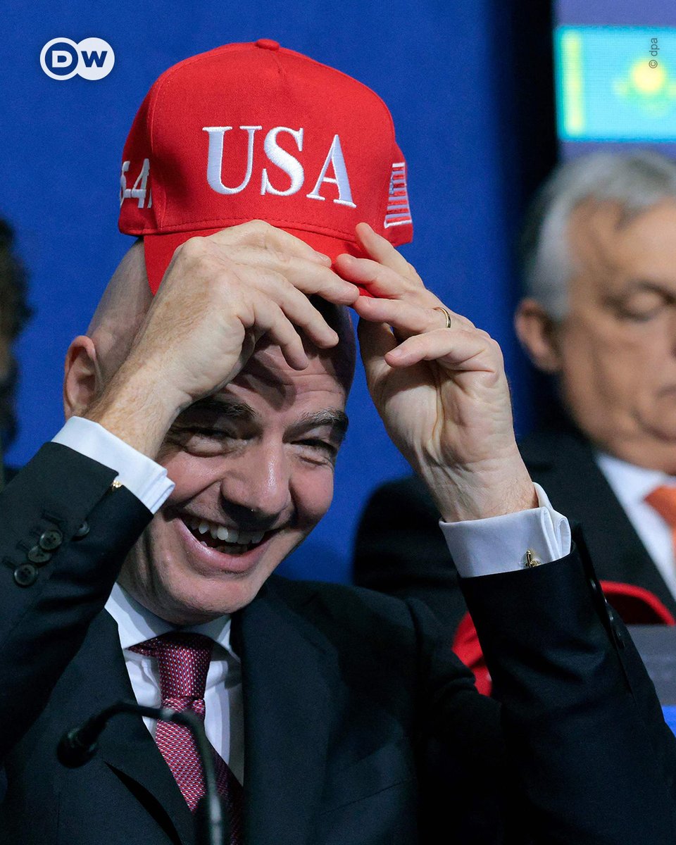 FIFA president Gianni Infantino in 2022:  "Please do not allow football to be dragged into every ideological or political battle that exists."

Infantino in 2026, at the inaugural Board of Peace meeting hosted by US President Donald Trump.