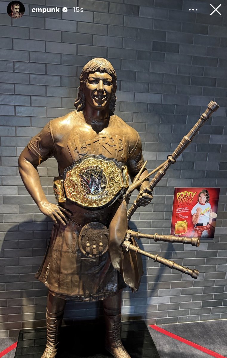 FadeAwayMedia's tweet photo. Cm Punk puts the World Heavyweight Championship on Roddy Pipers statue ❤️ https://t.co/omURpvS8iI