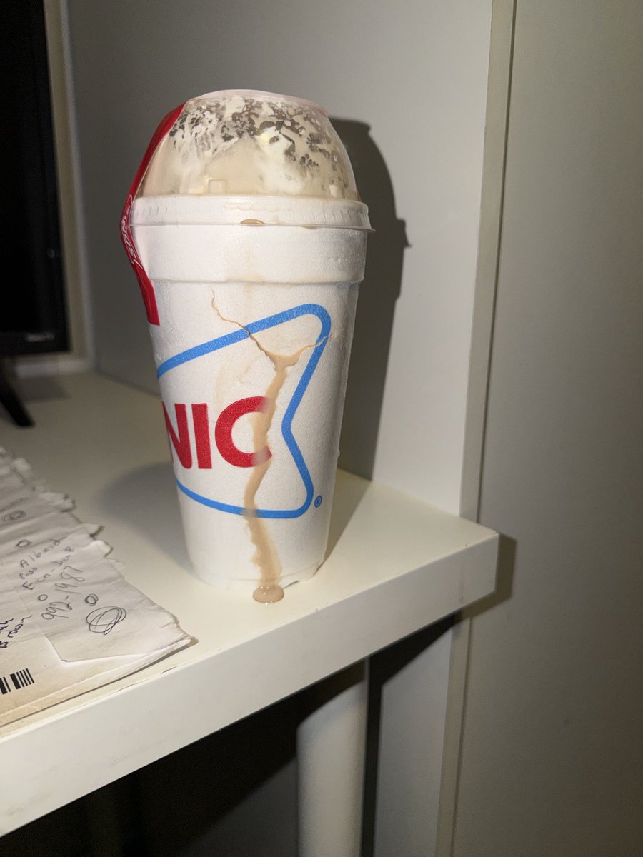 Jeff7000's tweet photo. @UberEats @Uber_Support Again another order issues. my order had a damaged to cup of the milk shake. It was melted and as you can see it leaking through the crack. Plus saw your delivery driver grab my order from trunk of his car. This unacceptable https://t.co/zl6kotFyYb