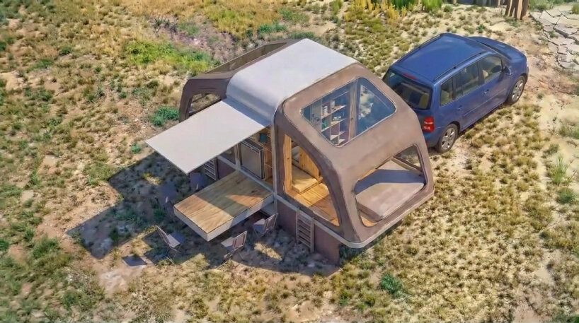 designboom's tweet photo. foldable tent box transforms from a wooden cabinet into a wing-like mobile shelter https://t.co/wFLqNyspVP https://t.co/vfQrJElWmc