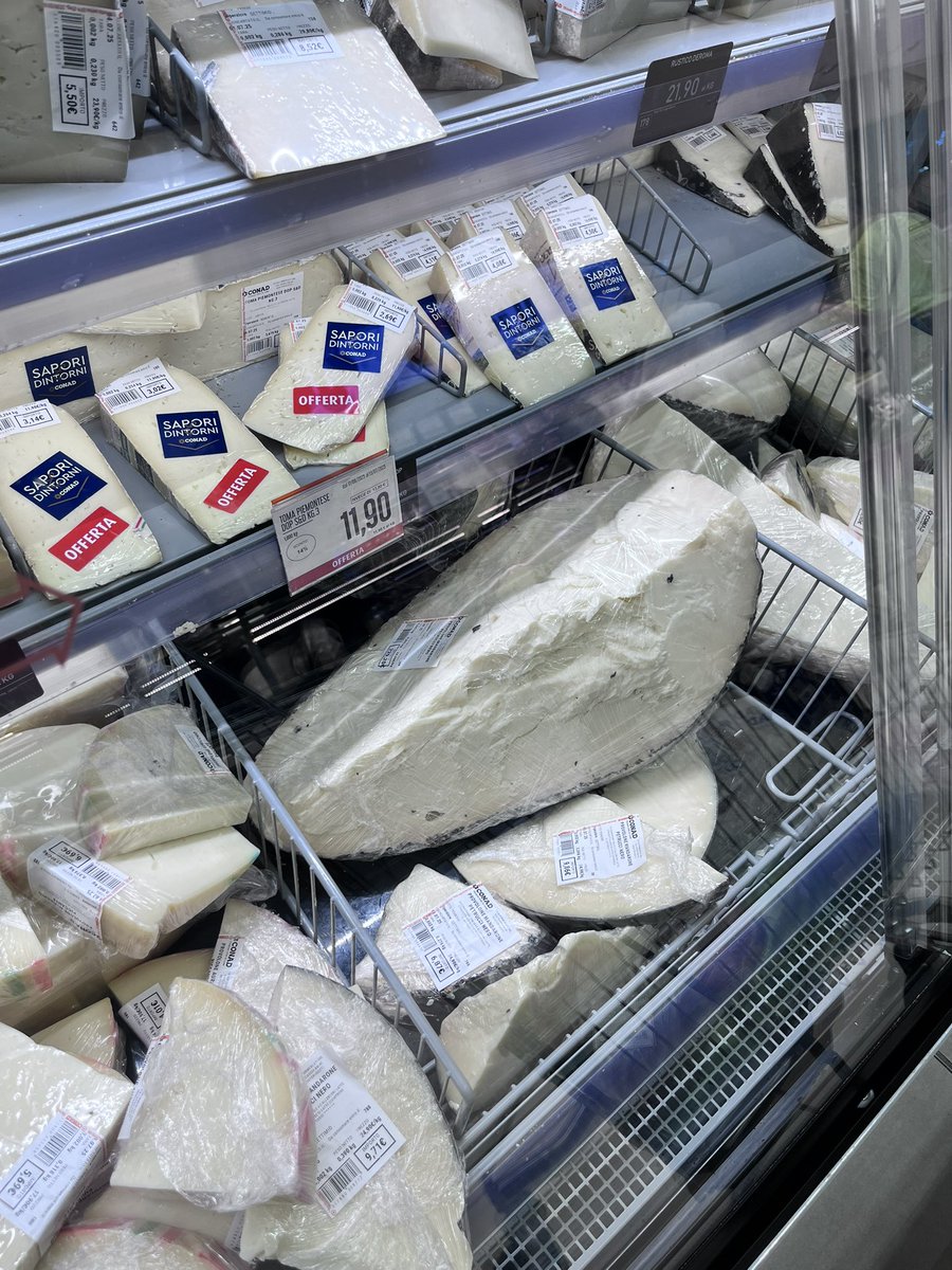 Grocery shopping in Italy: 
do I need to invest in this 9.2 kilogram slice of cheese at 229€ ?